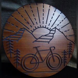 15" Wooden Round Wall Art -  Mountain Sunset  Metal Bike & Trees gives dimension